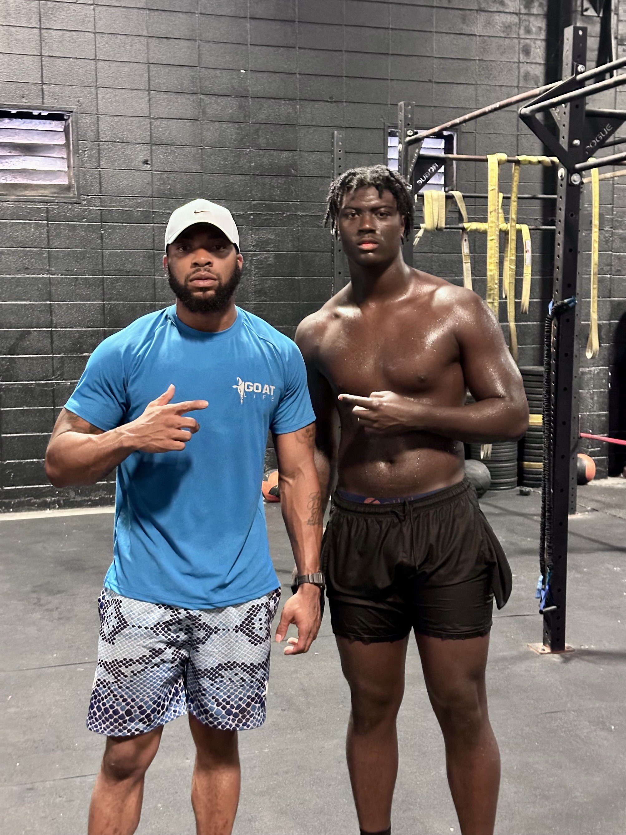 Coach Rique with a GOAT LIFE athlete after a training session